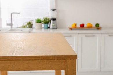 Stylish wooden table in kitchen. Interior design