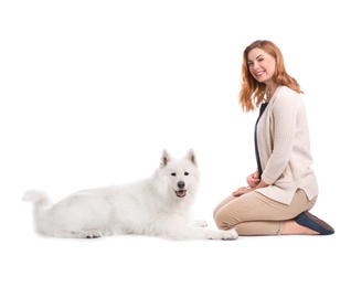 Photo of Beautiful woman with her cute dog on white background
