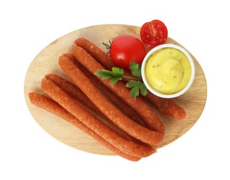 Photo of Thin dry smoked sausages with tomatoes and sauce isolated on white, top view