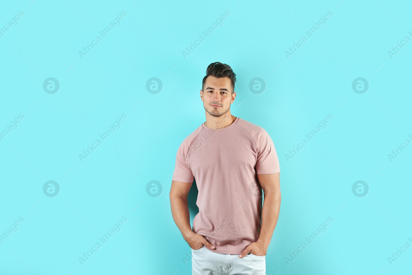 Photo of Young man in t-shirt on color background. Mockup for design