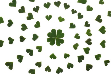 Photo of Composition of green clover leaves on white background, flat lay