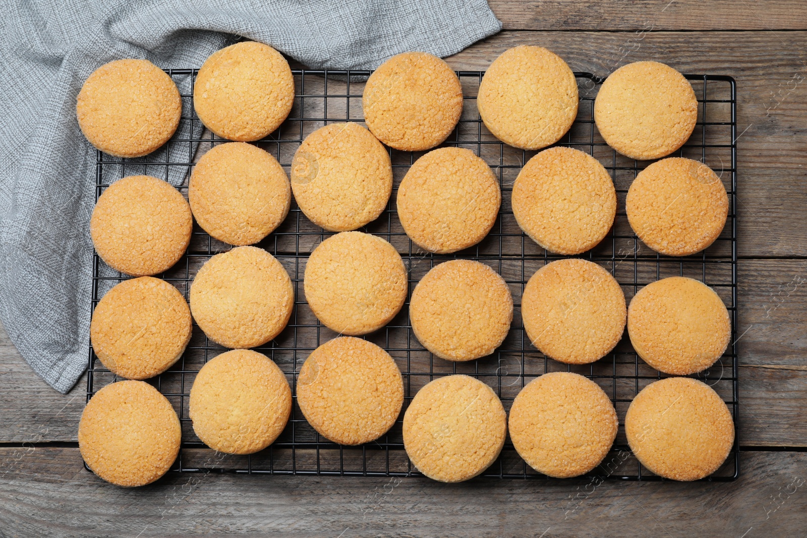 Photo of Many tasty sugar cookies on wooden table, top view