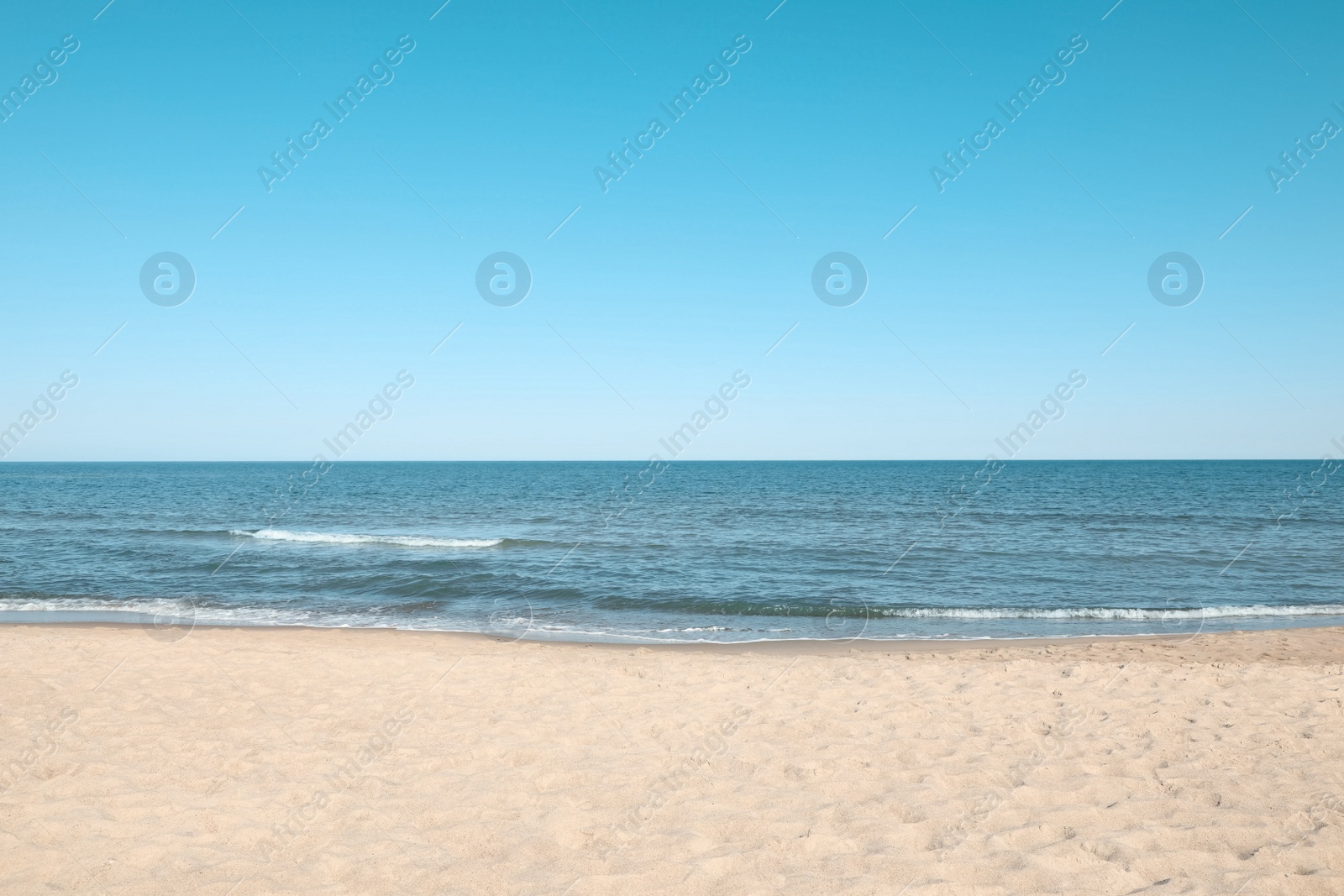 Photo of Picturesque view of sandy beach near sea