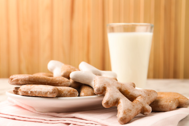 Photo of Sweet delicious cookies and milk on table