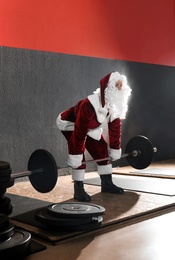 Young Santa Claus training in modern gym