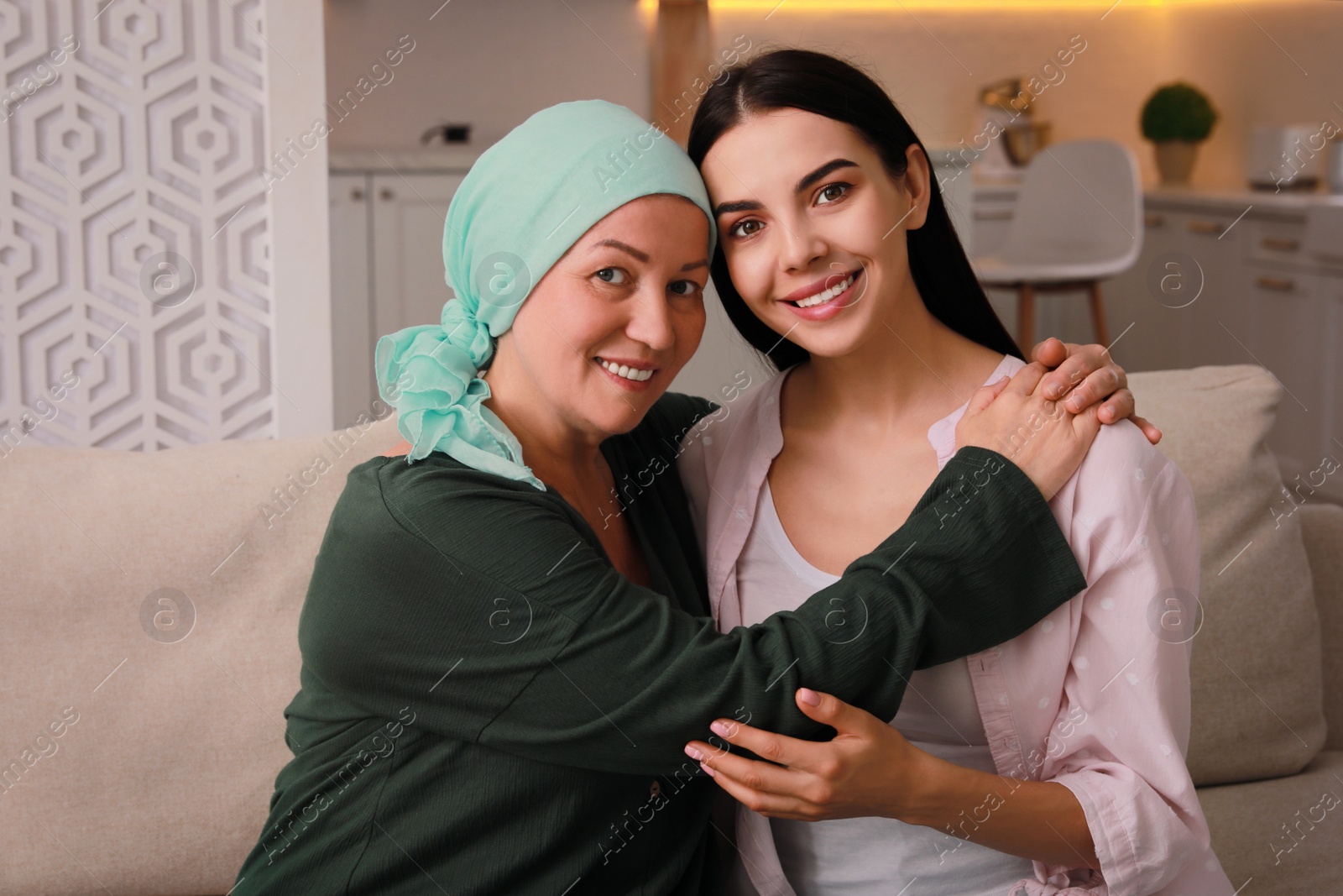 Photo of Young woman visiting her mother with cancer indoors