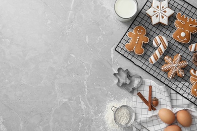 Flat lay composition with delicious homemade Christmas cookies on grey marble table. Space for text