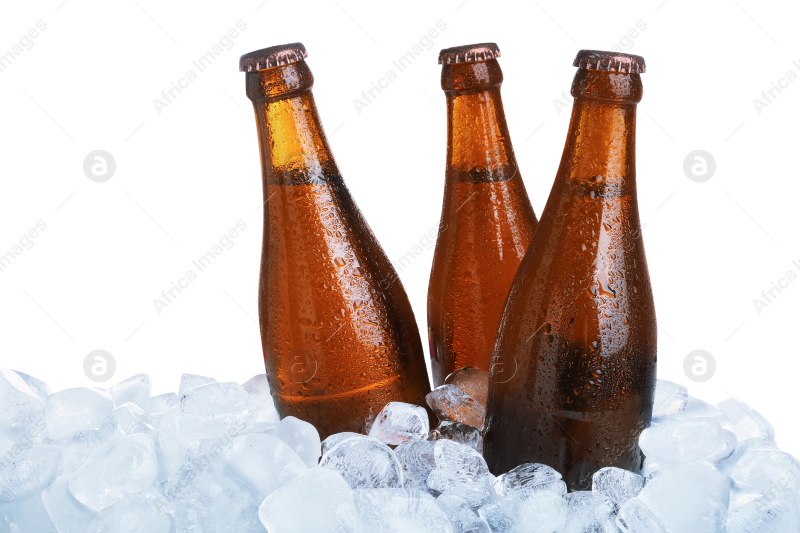 Photo of Ice cubes and bottles of beer on white background