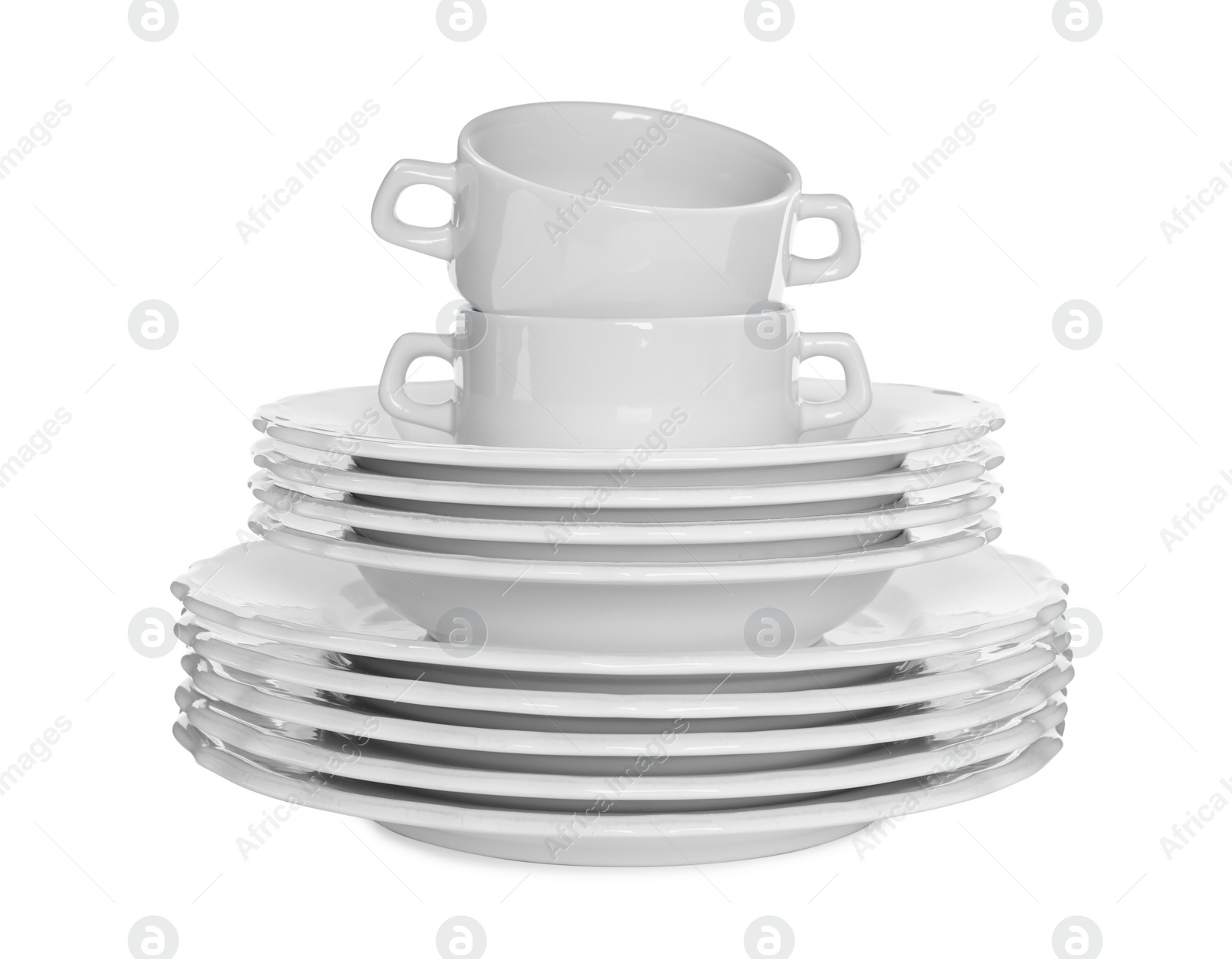 Photo of Stacked plates and cups on white background