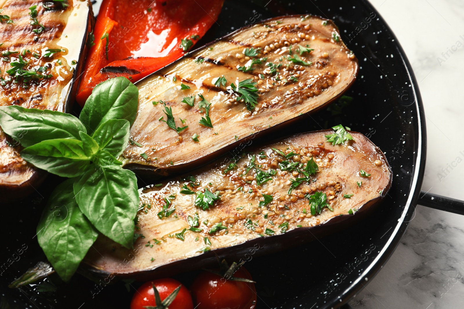 Photo of Grill pan of fried eggplants, closeup view