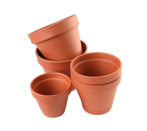 Photo of Empty clay flower pots isolated on white