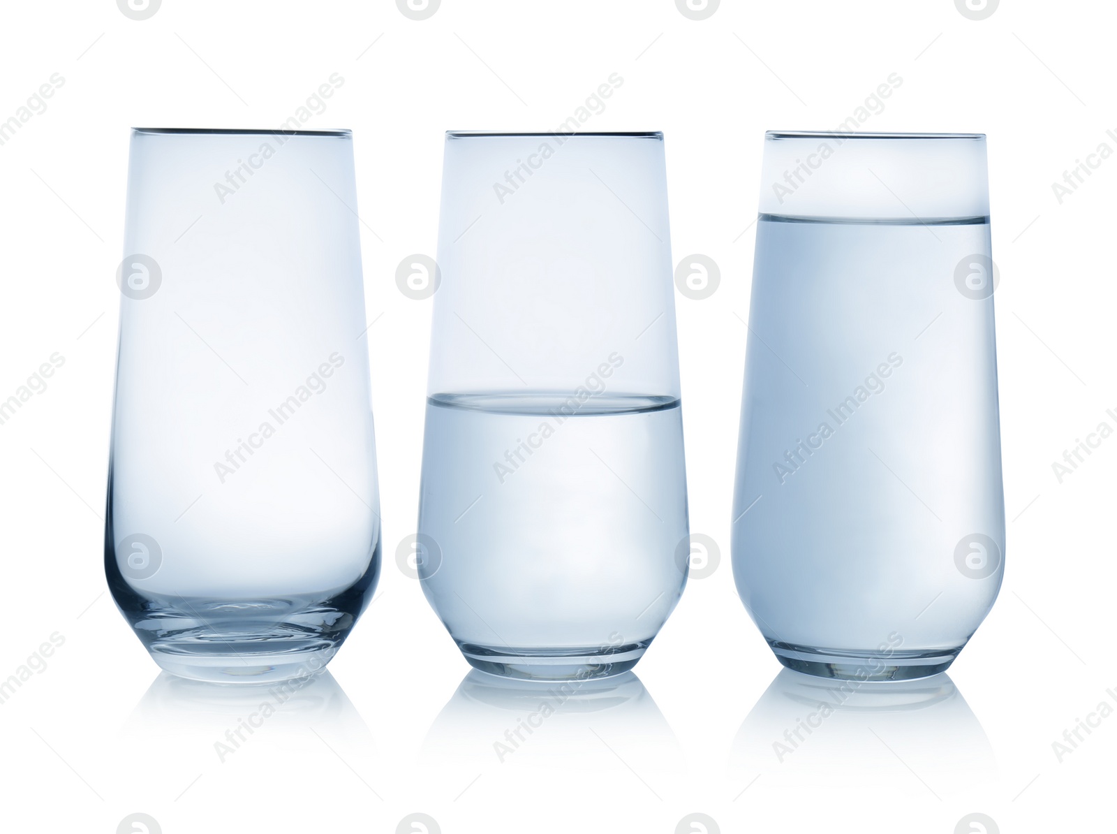 Photo of Empty, half and full glasses of water on white background