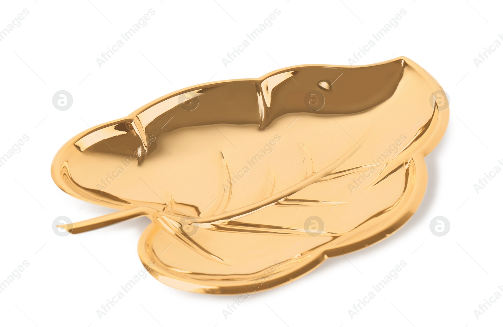 Photo of Trendy gold leaf shaped plate on white background