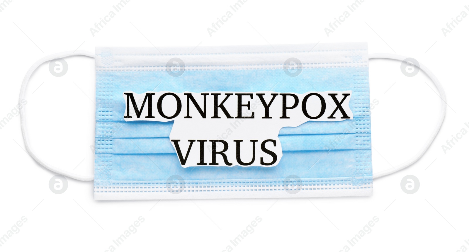 Photo of Medical face mask with words Monkeypox Virus on white background, top view