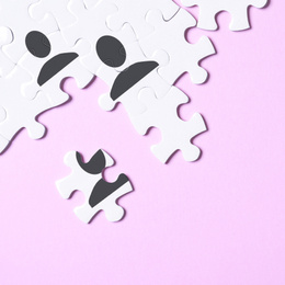 Image of Partnership concept. White puzzle pieces on pink background, flat lay 