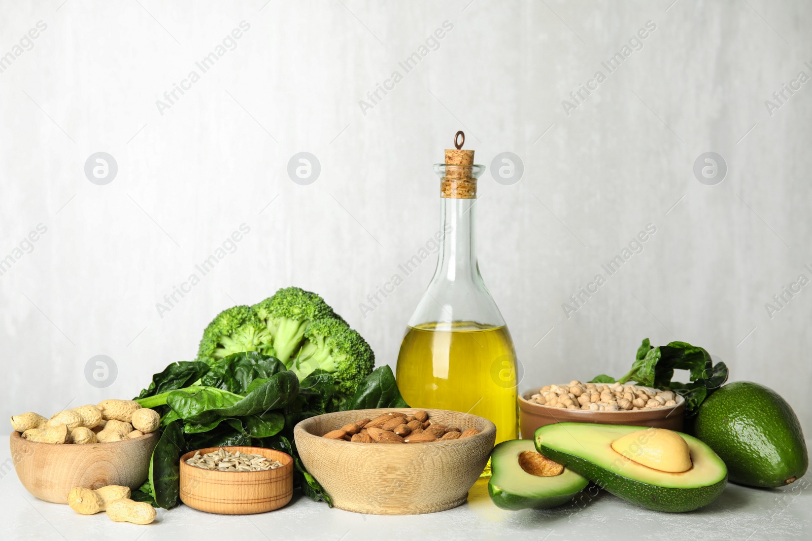 Photo of Different products rich in vitamin E on white table