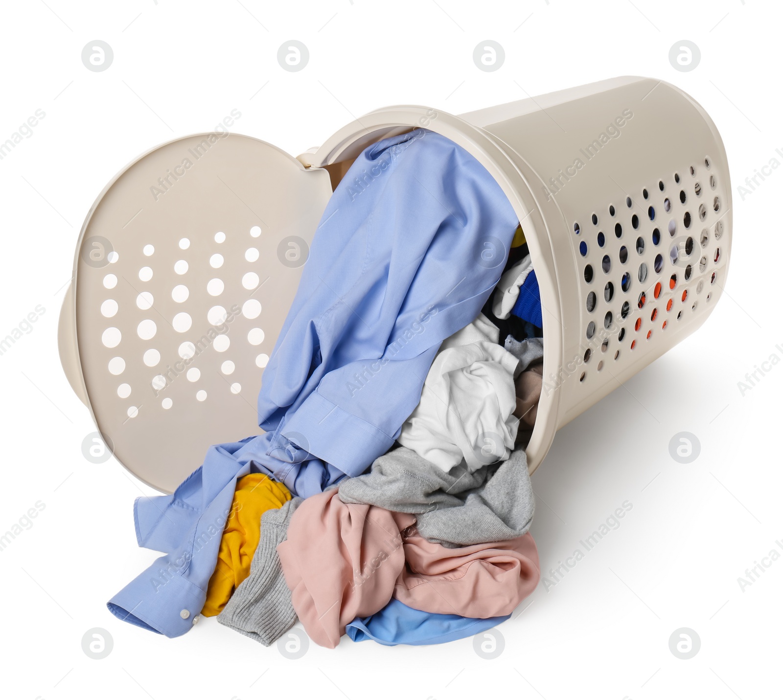 Photo of Overturned laundry basket full of clothes isolated on white