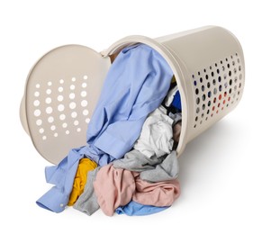 Overturned laundry basket full of clothes isolated on white