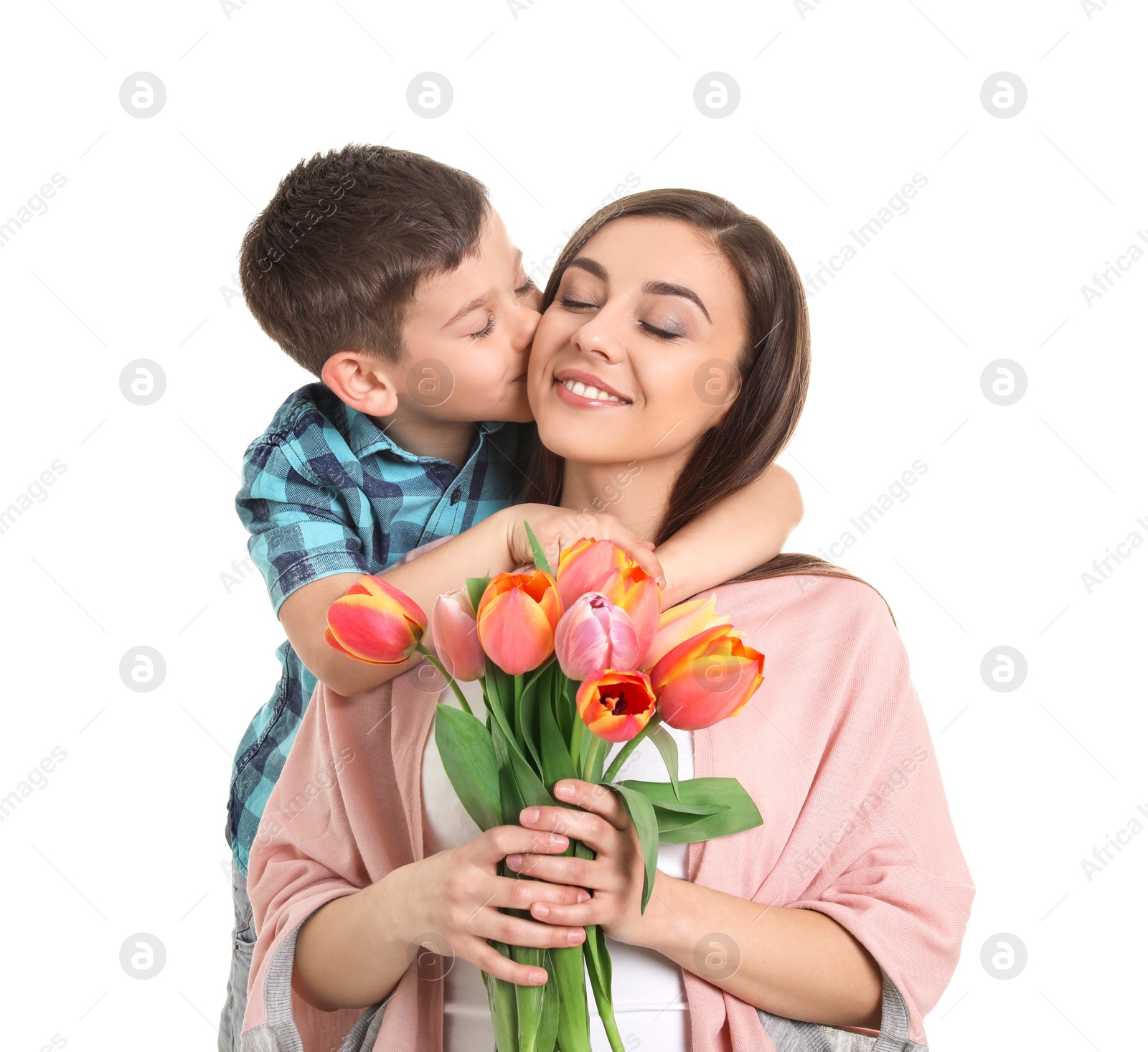 Photo of Portrait of happy woman with flowers and her son on white background. Mother's day celebration