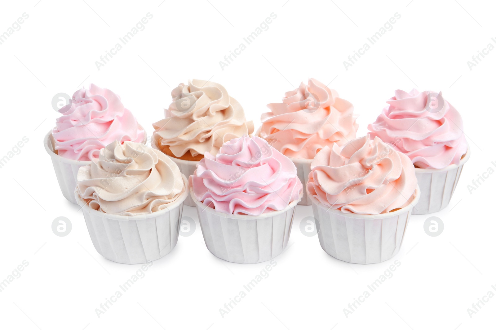 Photo of Tasty cupcakes with cream isolated on white