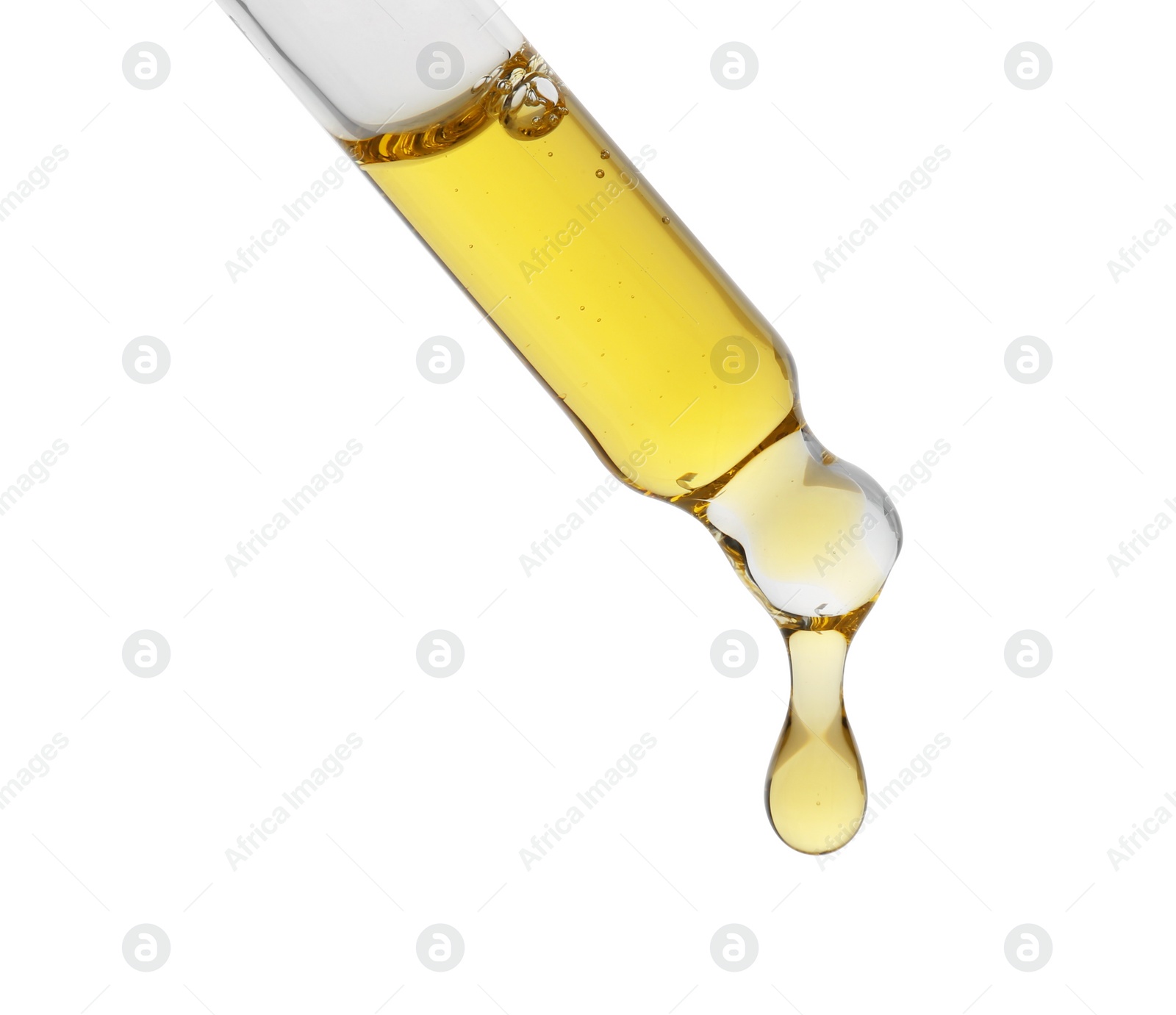 Photo of Dripping tincture from pipette isolated on white