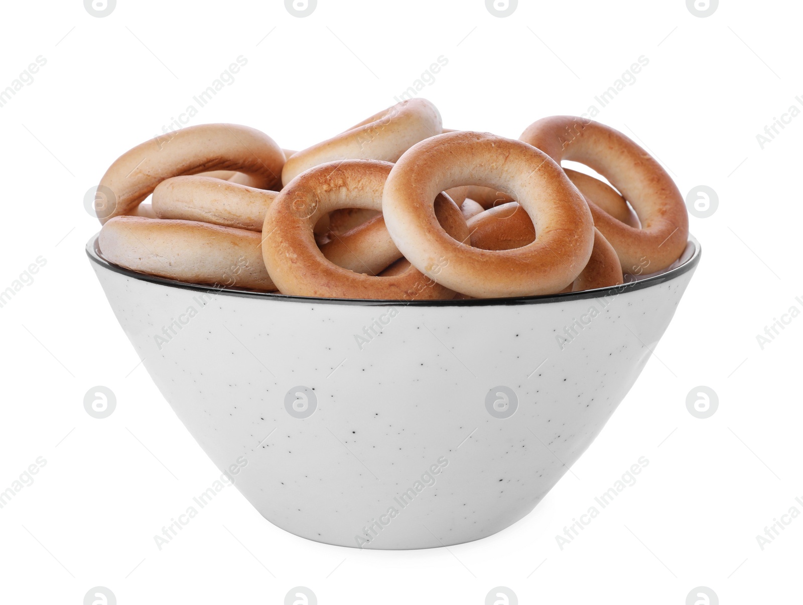 Photo of Bowl with tasty dry bagels (sushki) isolated on white