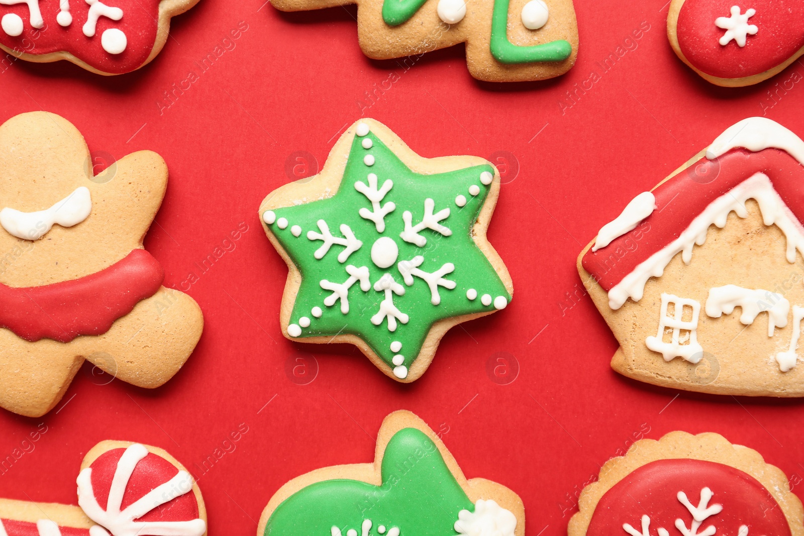 Photo of Flat lay composition with tasty homemade Christmas cookies on red background