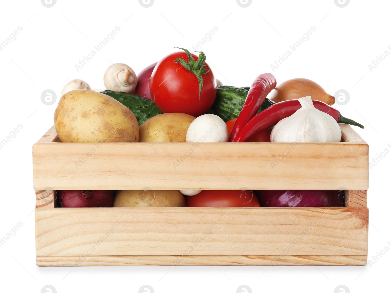 Photo of Wooden crate full of fresh vegetables on white background