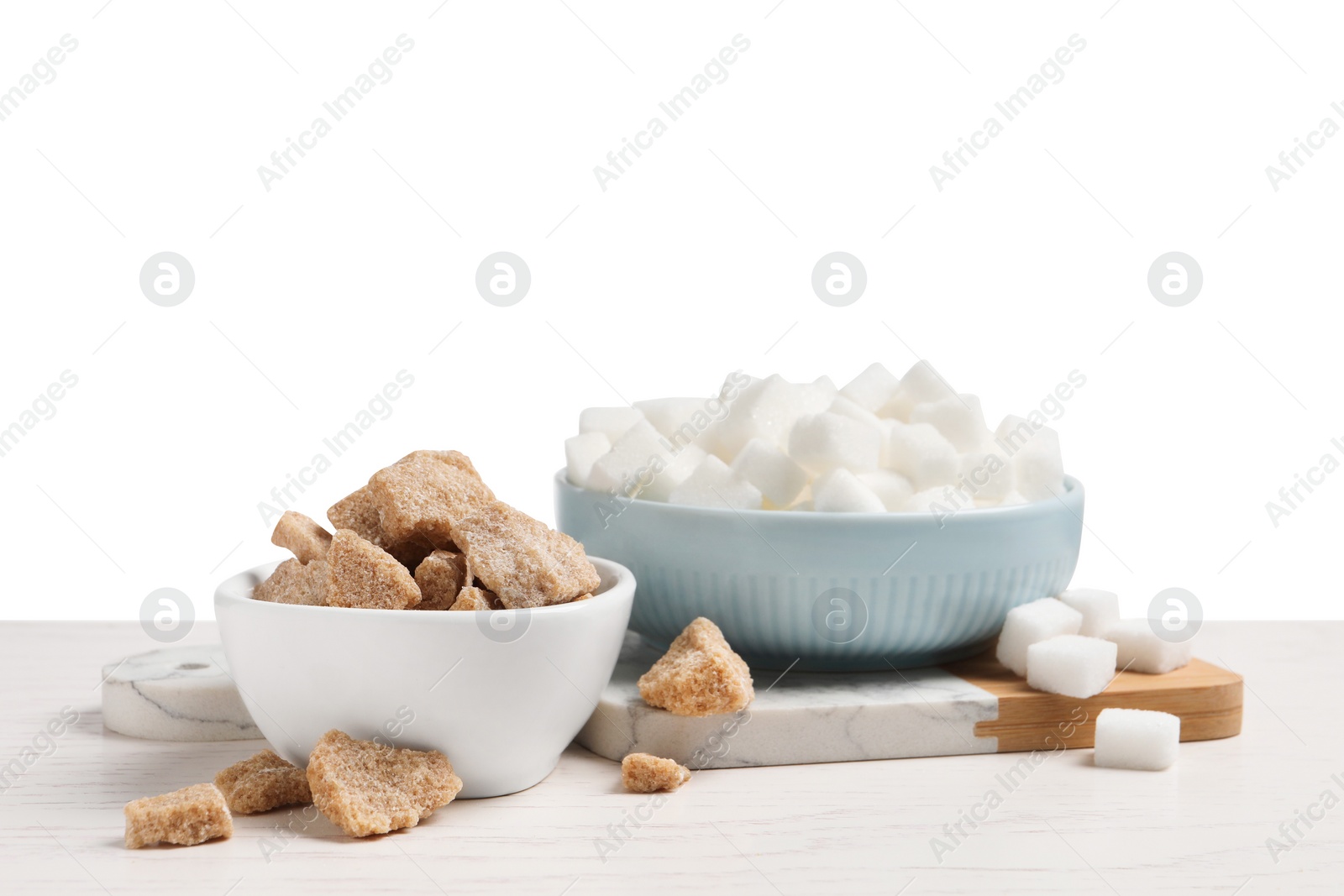 Photo of Different types of sugar on white wooden table