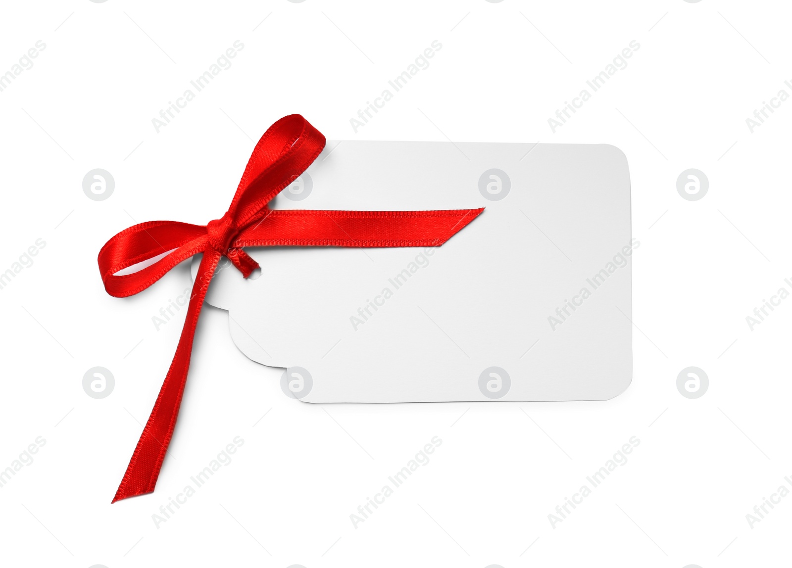 Photo of Blank gift tag with satin ribbon on white background, top view