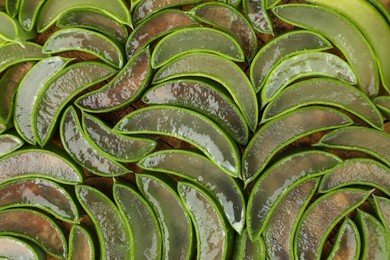 Photo of Sliced fresh aloe vera as background, top view