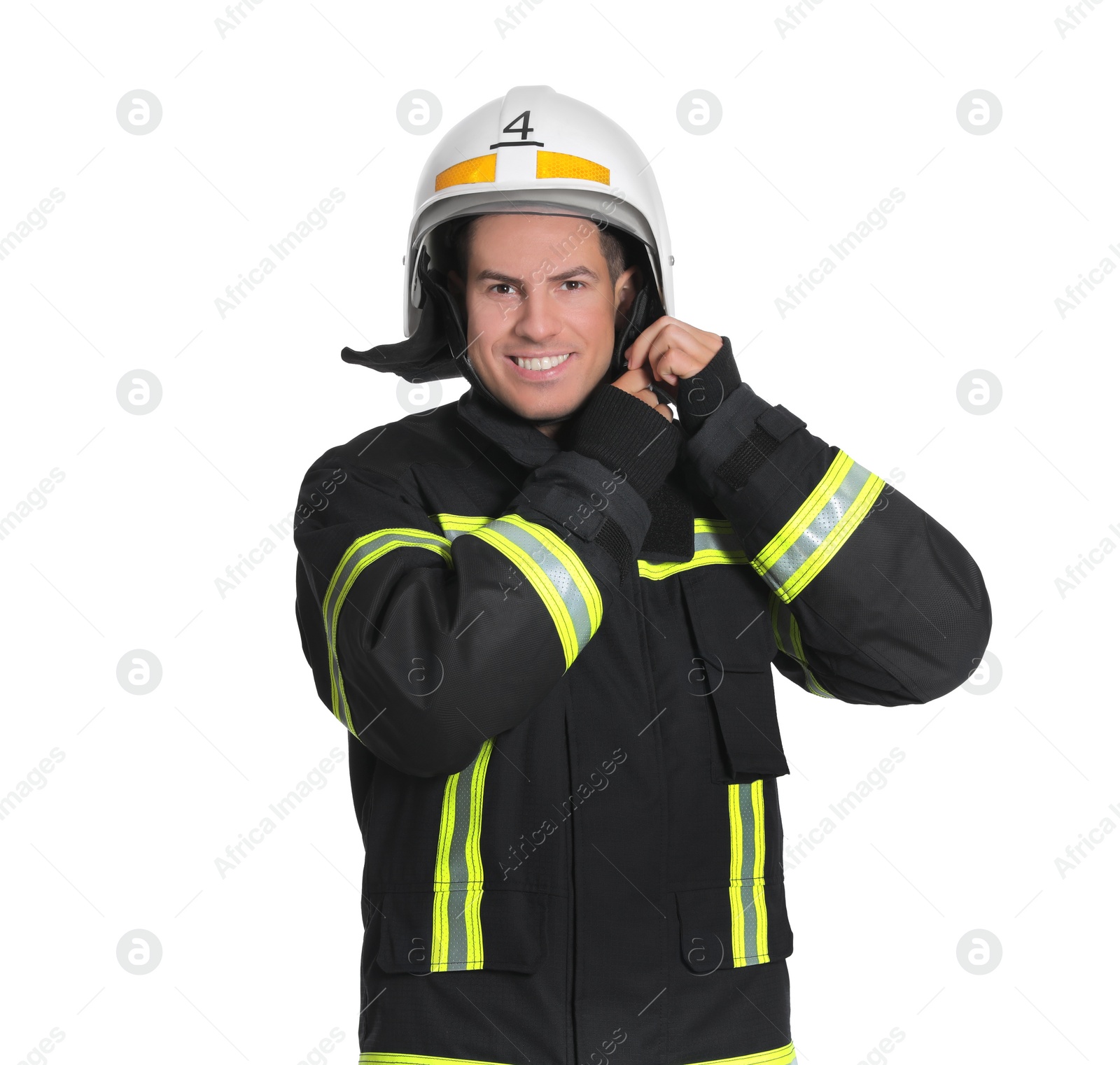 Photo of Portrait of firefighter in uniform wearing helmet on white background