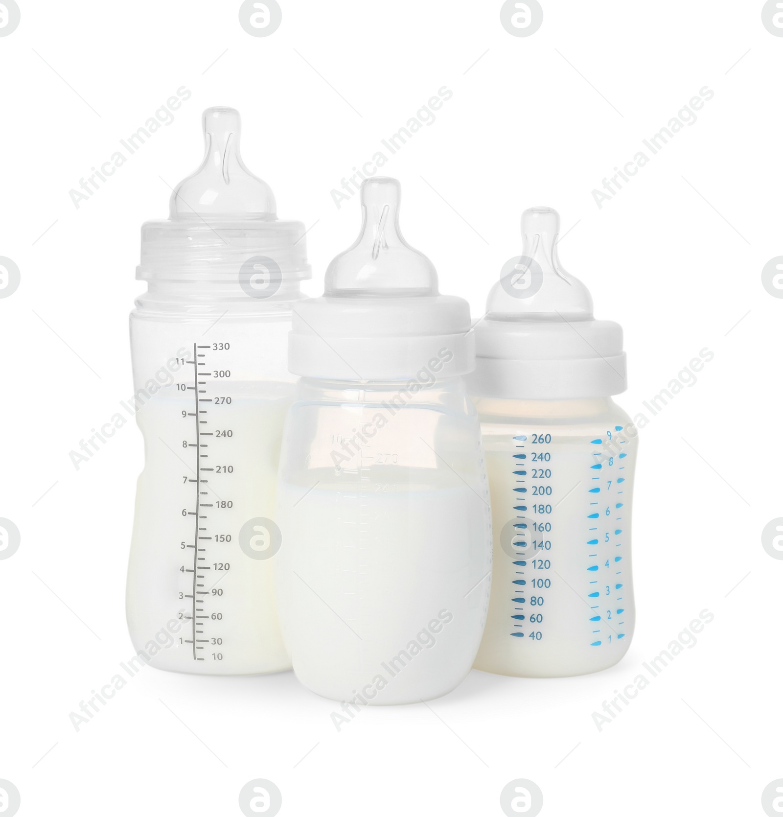 Photo of Three feeding bottles with infant formula on white background