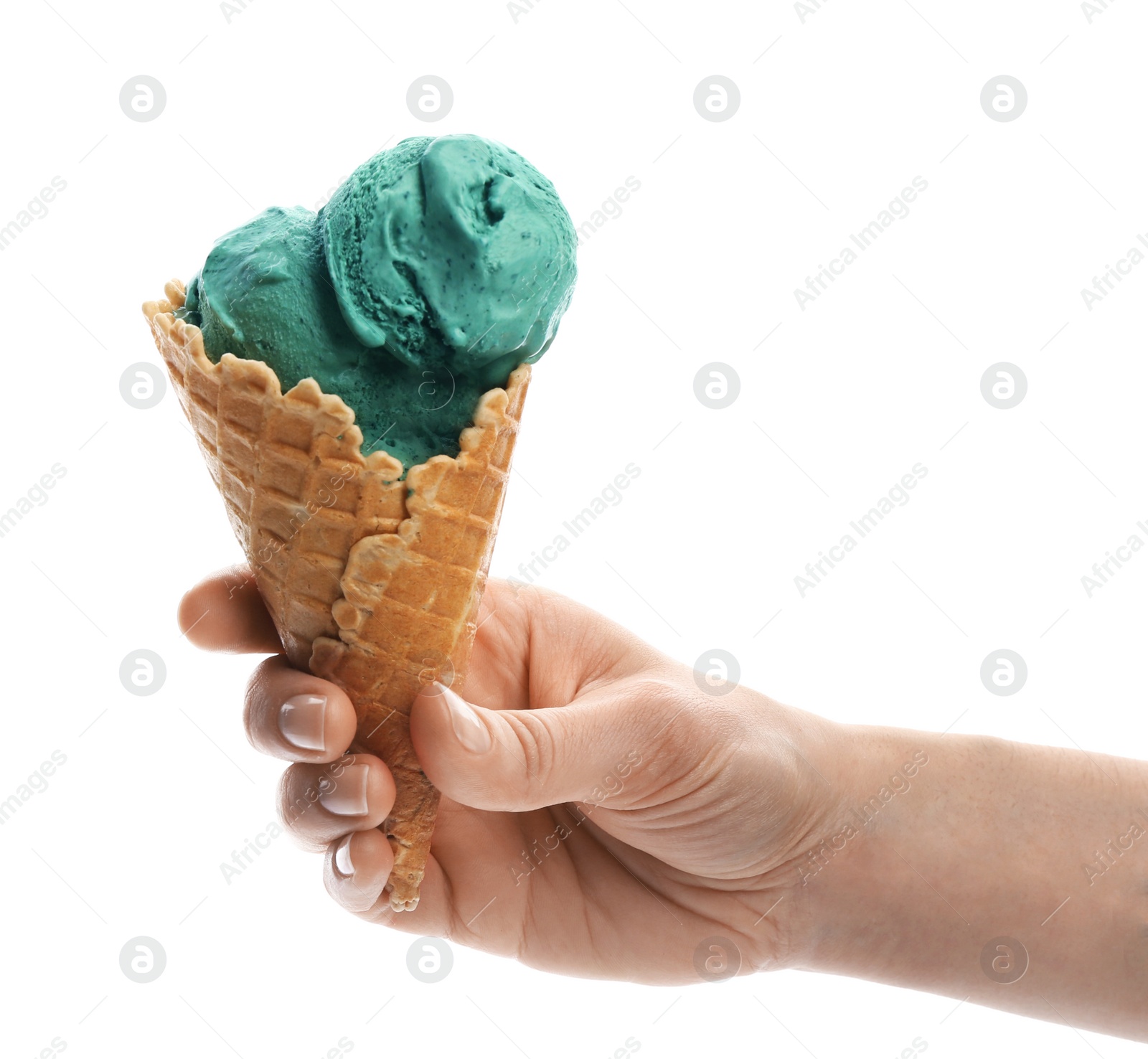 Photo of Woman holding spirulina ice cream cone on white background, closeup