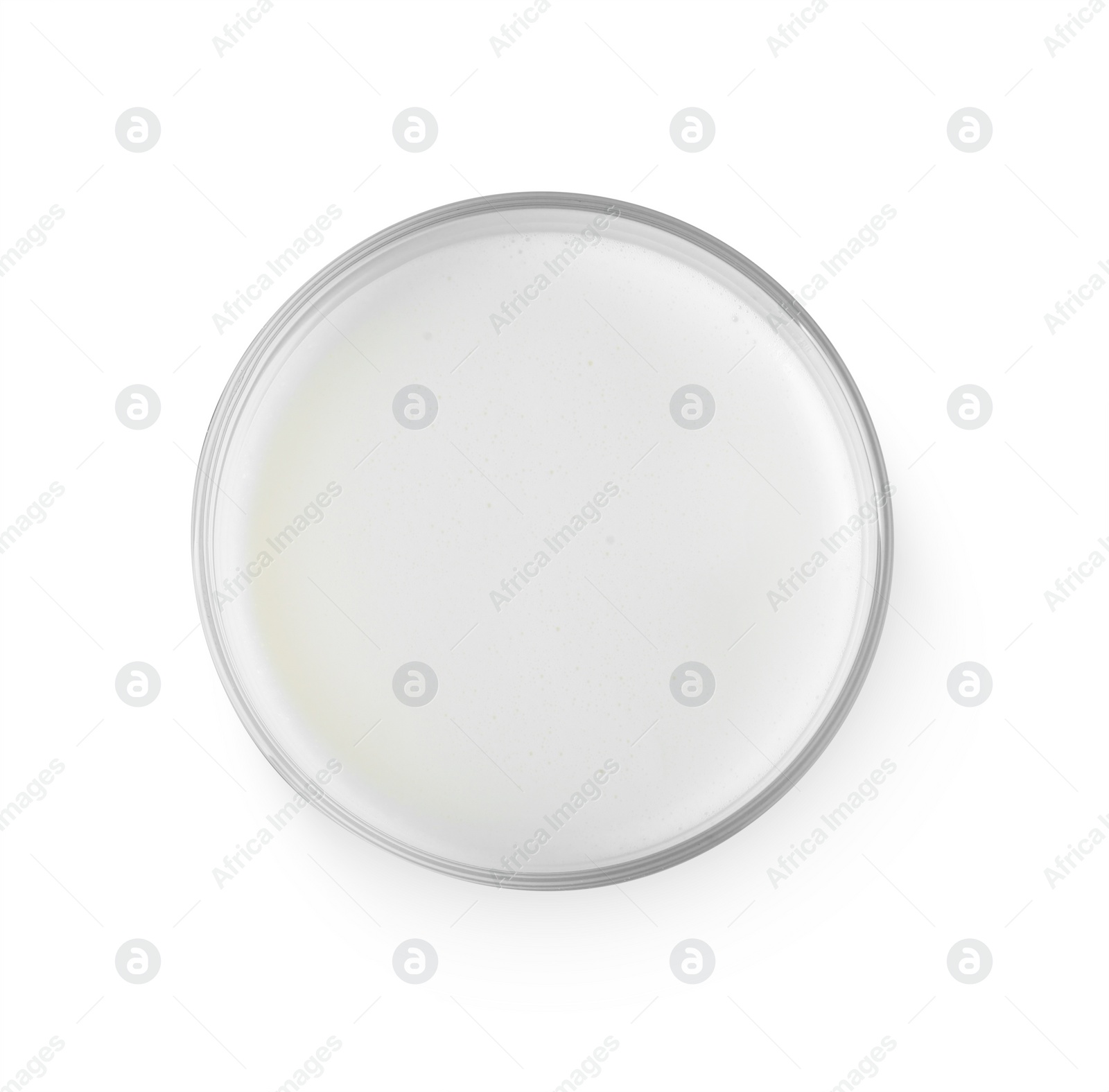 Photo of Glass of fresh milk isolated on white, top view