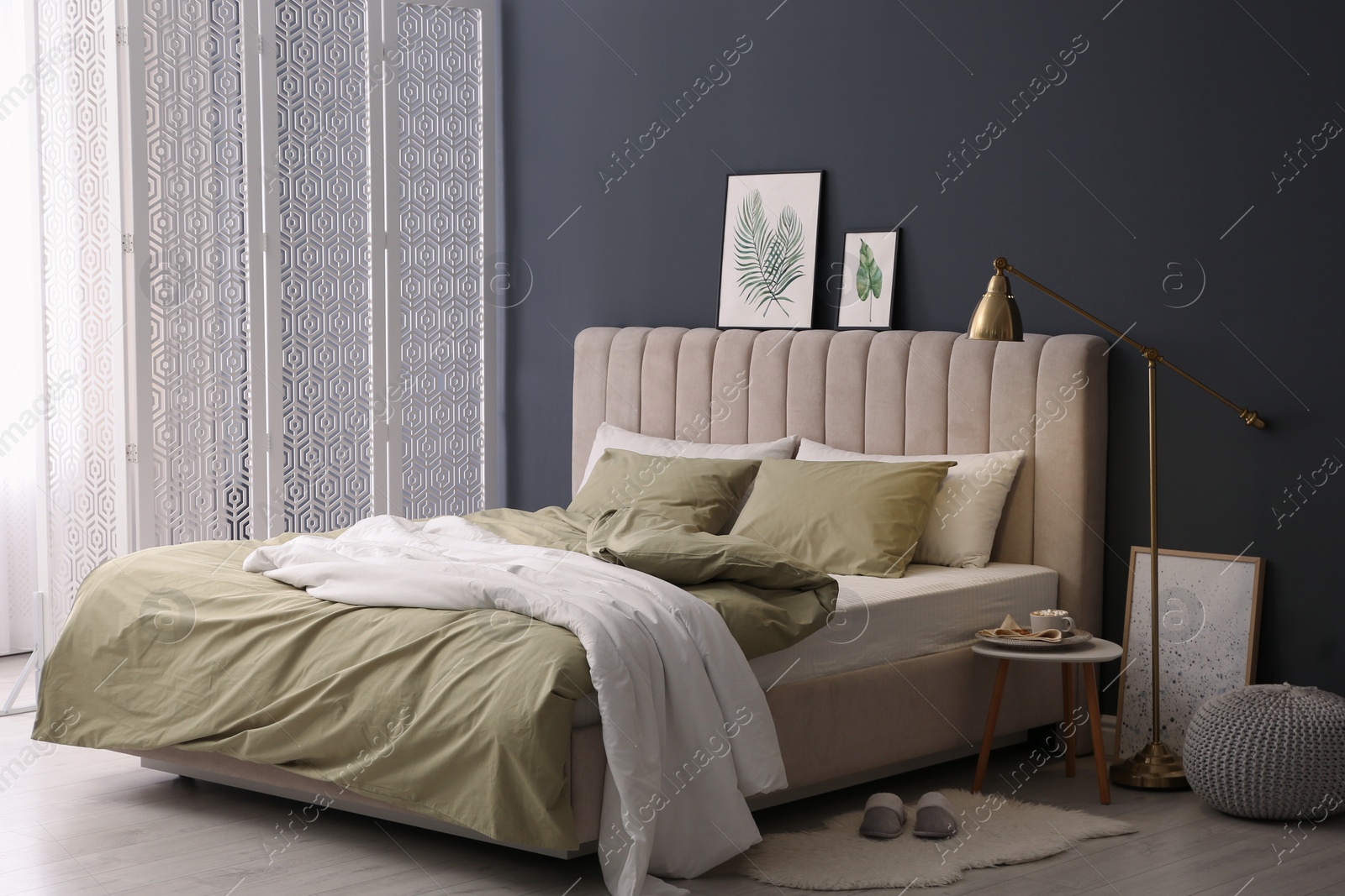 Photo of Comfortable bed with new pistachio linens in modern room interior