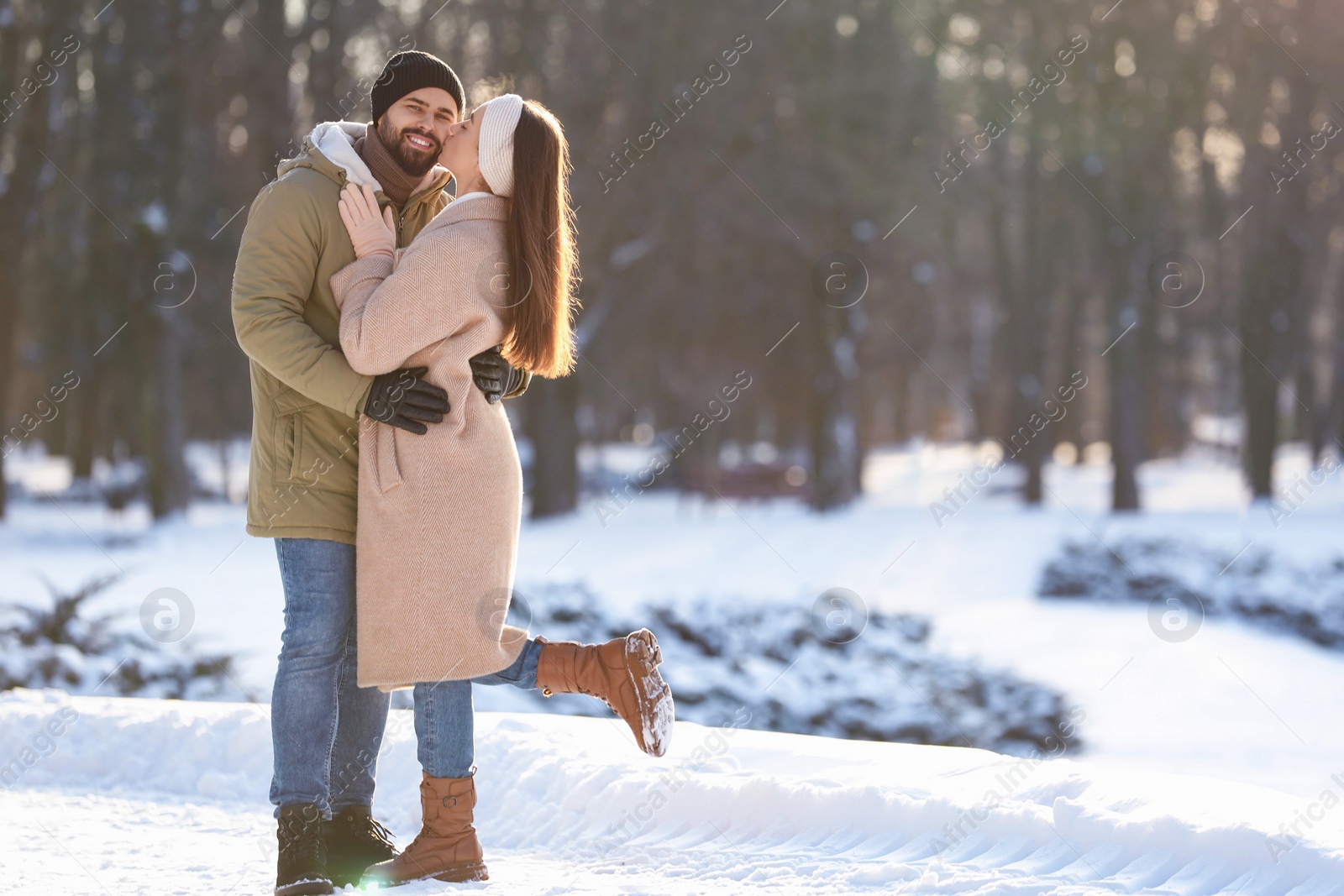 Photo of Beautiful young couple enjoying winter day outdoors