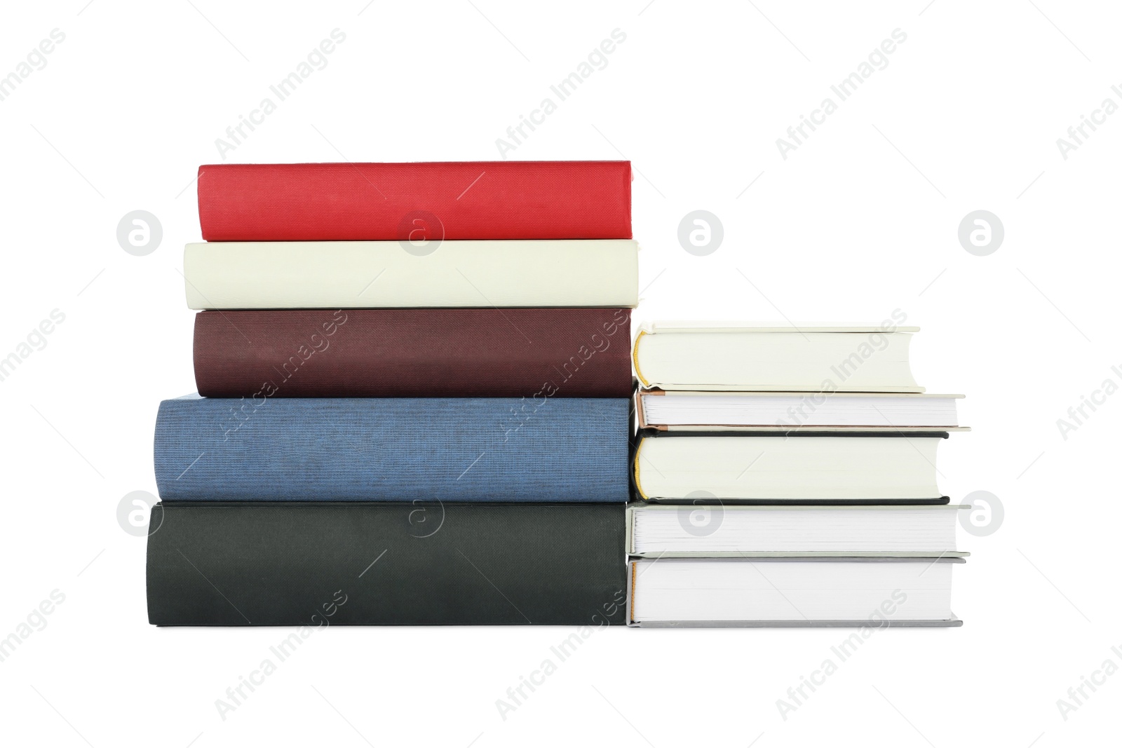 Photo of Many different books stacked on white background