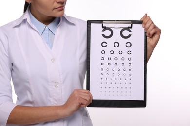 Ophthalmologist with vision test chart on white background, closeup