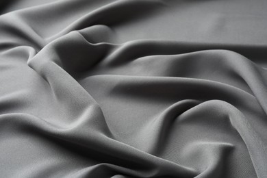 Texture of grey crumpled silk fabric as background, closeup