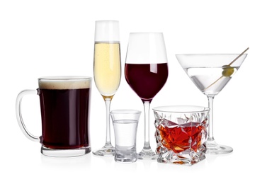 Photo of Many different alcoholic drinks on white background