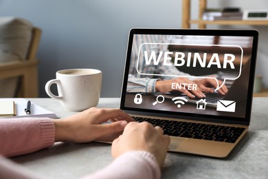 Image of Webinar. Woman using laptop at table, closeup