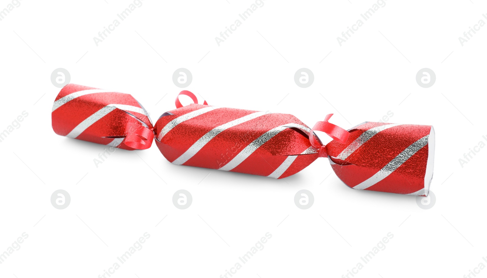 Photo of Bright striped Christmas cracker isolated on white