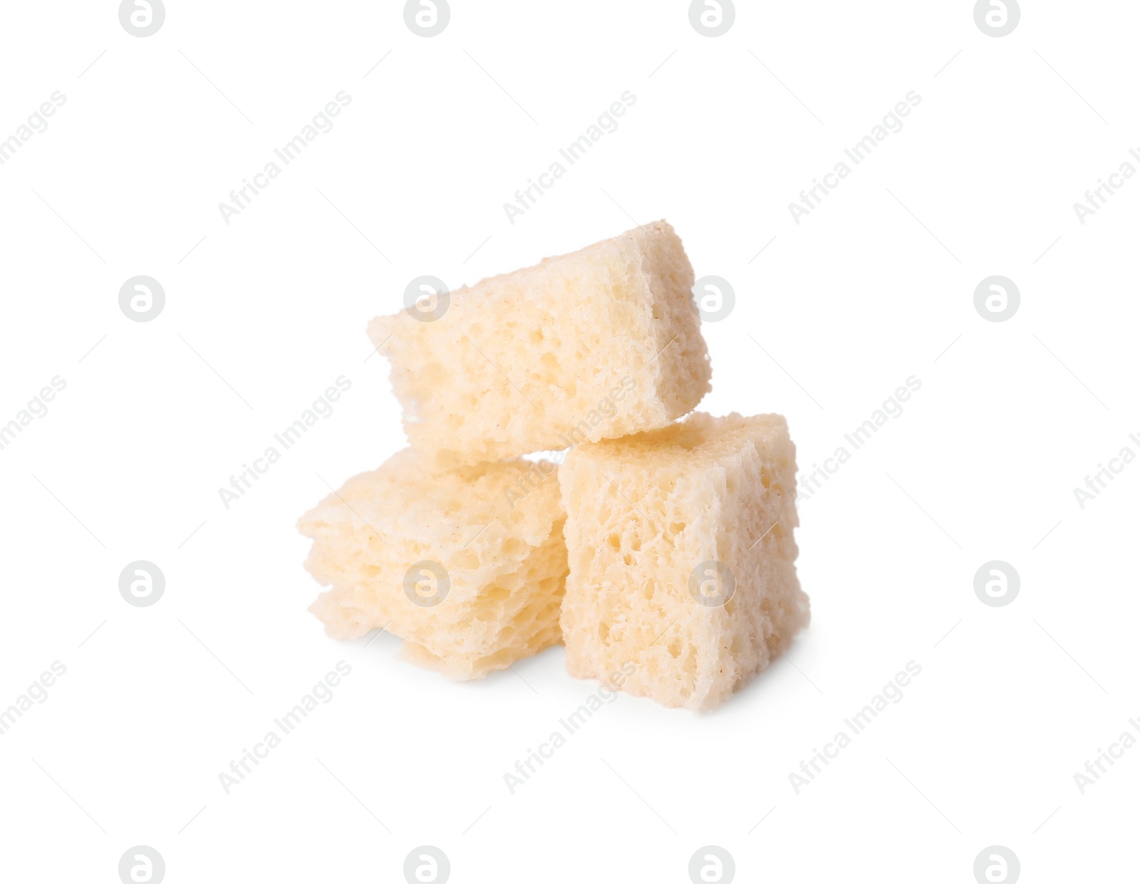 Photo of Crispy croutons on white background. Tasty snack