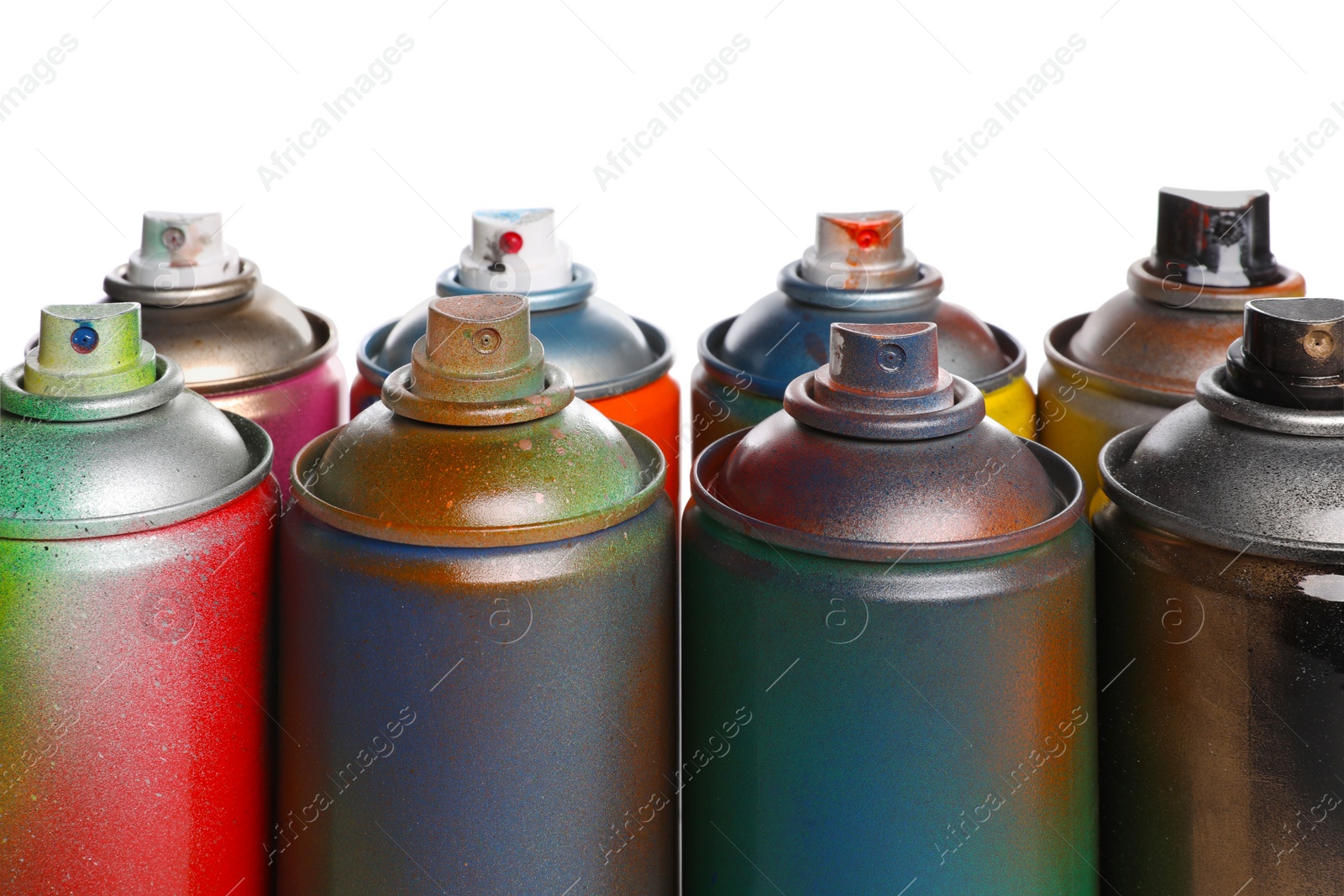 Photo of Used cans of spray paints on white background