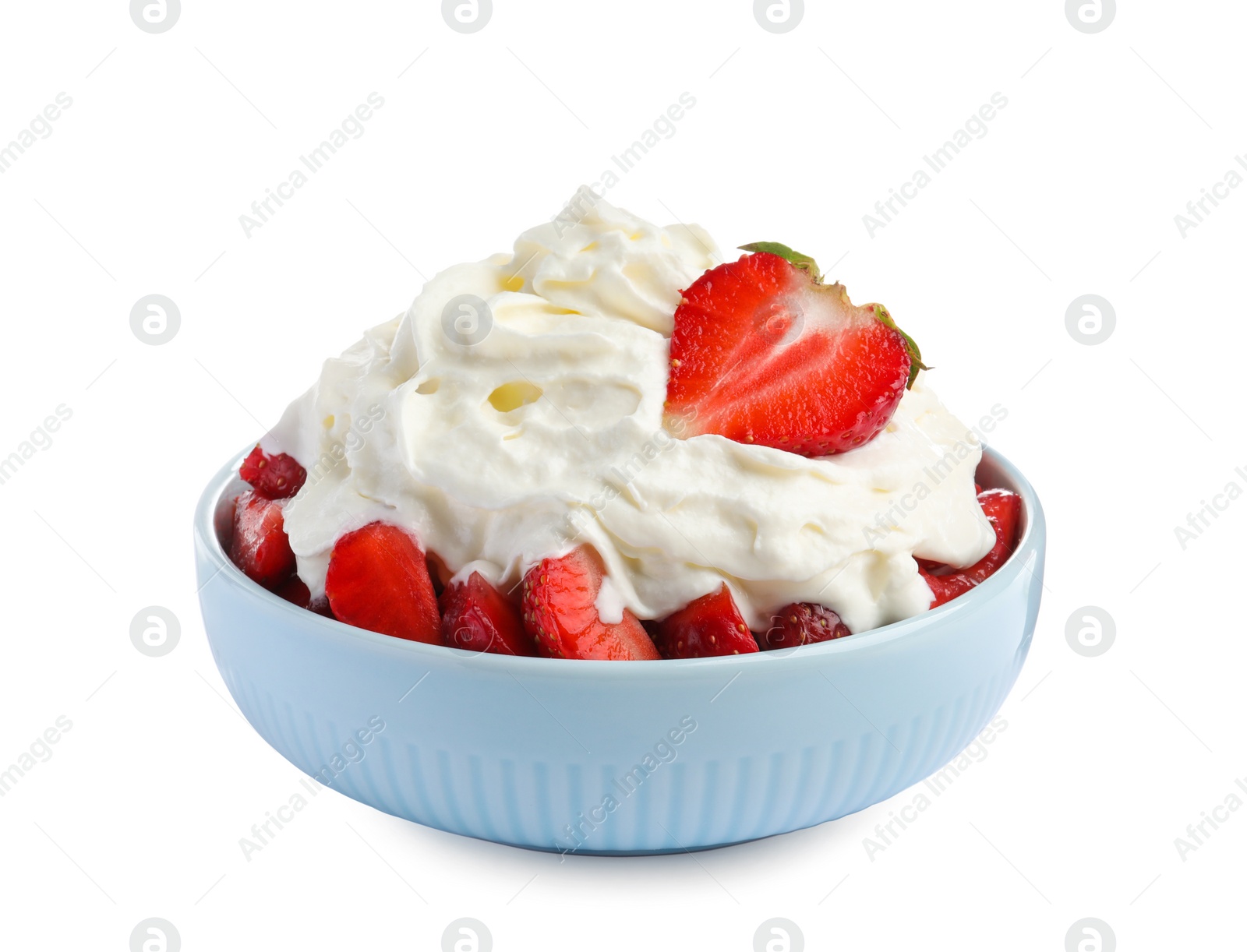 Photo of Tasty sliced strawberry with whipped cream in bowl isolated on white