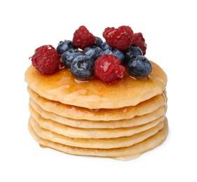 Photo of Stack of tasty pancakes with berries and honey isolated on white