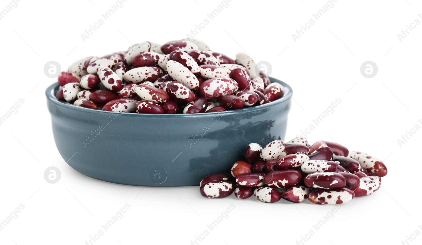 Photo of Bowl and dry kidney beans on white background