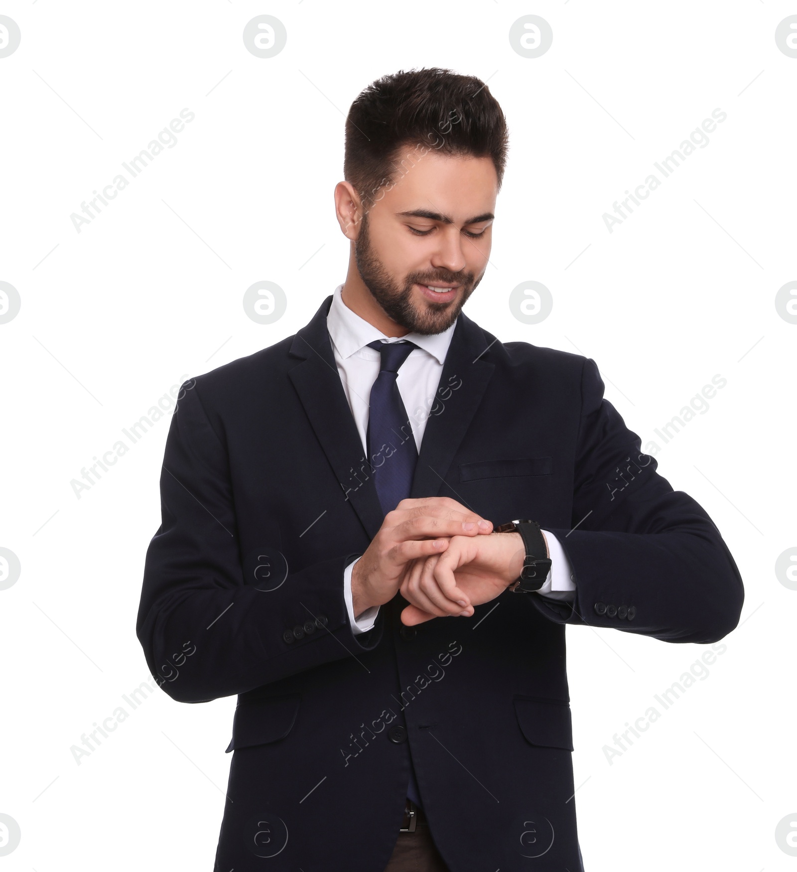Photo of Young businessman checking time on white background