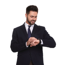 Photo of Young businessman checking time on white background